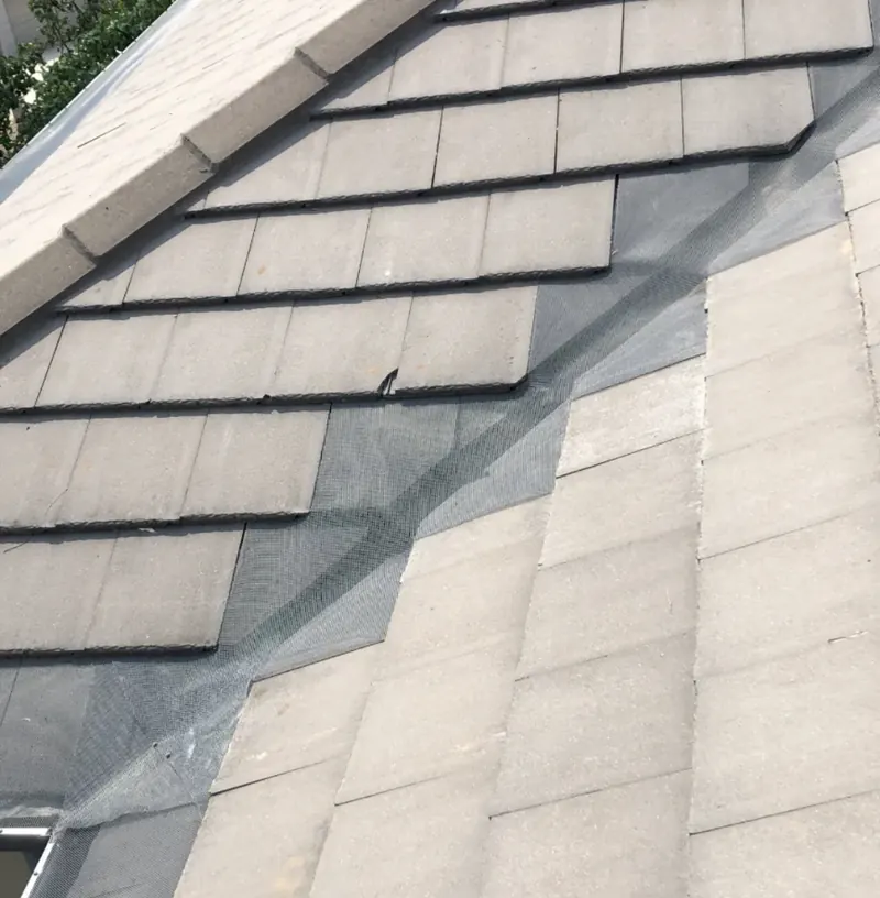 Mesh fitted into a tiled roof valley